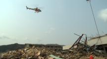 Japan Tsunami Aftermath - Helicopter Flies Over Damaged Hospital In Rikuzentakata City