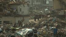 Japan Tsunami Aftermath - Rescue Crew In Remains Of Destroyed Rikuzentakata City