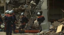 Japan Tsunami Aftermath - Rescue Team Retrieve Body From Destroyed Building In Rikuzentakata City