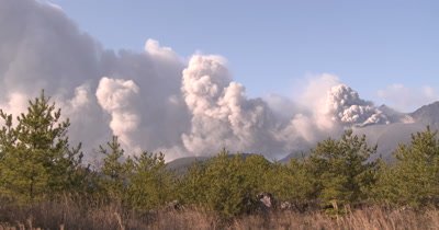 Volcano Eruption Spews Ash Cloud Into Air Wide Shot