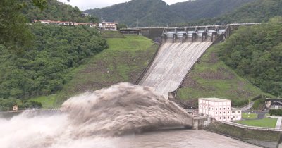 Flood Waters Blast From Dam Hydroelectric Plant