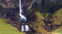 High Waterfall Plummets Down Cliff