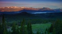 Panorama Across Mountain Valley At Sunrise With Fog In Valley Floor - Wide