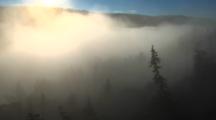 Time Lapse Of Clouds/Fog Rolling Out Of Valley As Sun Rises - Wide
