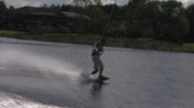Wakeboarder - Behind Boat-Attempts To Switch Direction And Loses His Board