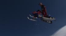 Slow Motion, Snowmobiler Gets Air Off A Natural Lip.