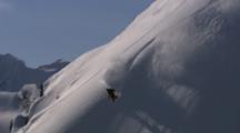 Snowboarder Rides A Steep Powder Line.