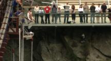 A Tourist Bungy Jumps From A Bridge.