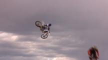 A Line Of Motocross Riders Do Big Whips.