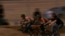 Tracking Bmx Riders Racing Around A Dirt Track.