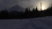 Time Lapse Of Snowmobilers Traveling Through Snowy Valley