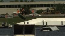 Wakeskater Doing A Trick On A Jump.