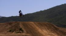Motocross Rider Riding A Dirt Track