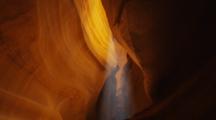 Antelope Canyon, Sandstone Slot Canyon. Shot Pans Up Then Down Then Up, Dust In Light Ray.