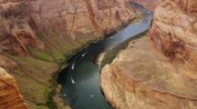 Looking Down On Horseshoe Bend, Arizona, Mesa And Colorado River With Speed Boats.