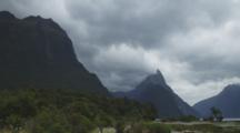 Milford Sound Coast And Beach, Mountains Are Visible, Cloudy And Windy Conditions