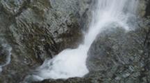 Detail Of Whitewater On Steep Rock Cliffs, Foaming Through A Crevice. South Island, New Zealand.