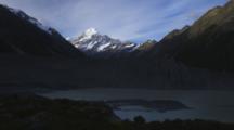 Glacial Moraine And Lake In Foreground, Mount Cook Rises Behind.
