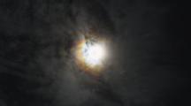 Shot Zooms Out. Clouds Form In An Ice Ring Around The Sun, With A Rainbow Coloration; A Sundog.