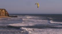 Kite Surfer Rides Out Through The Surf