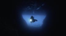  A Female Scuba Diver Explores A Large Cavern