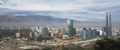 The City skyline of Santiago, Chile lies between mountains and extensively traps smog