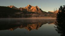 Mountains Reflected On Misty Lake