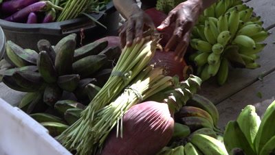 Papuan locals piling up fruits and vegetables for sale