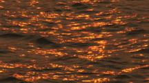 Sunset Reflected On Rippling Water