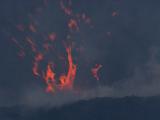 Molten Lava Explodes From Crater In Splatters