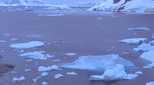 Ice Flow, Chunks Of Sea Ice Moving Past Icy Shore