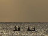 2 Outrigger Canoes, Each With 2 People Aboard, On Sparkling Sea, Distant Horizon