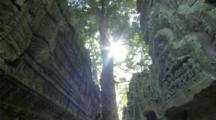 Dolly Glide Shot Of Angkor Ruins With Sunlight And Skull Sculpture 