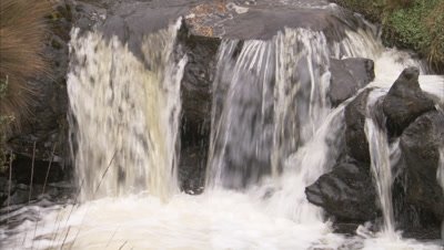 Small waterfall in scrubby landscape