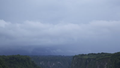Time lapse of the sun setting over Harau Valley; sunset covered by clouds