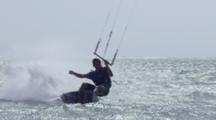 Kiteboarder Turning At Beach After Jump