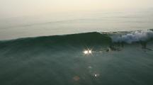 Aerial, Over Waves Into Rising Sun