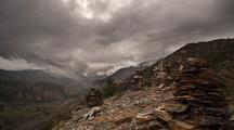 Heavy Clouds In The Ngawal Valley, Cairn In The Foreground.