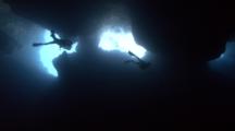 Scuba Divers Investigate Palau's Blue Holes Underwater Cavern