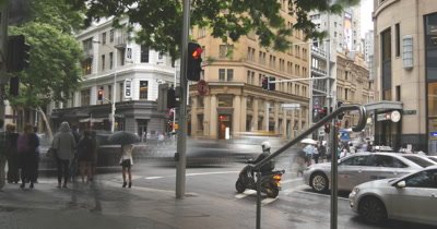 Establishing shot footage of busy city street vehicle car traffic transport congestion during commuter rush hour or peak hour timelapse with slow shutter to get the blurred motion effect. George St Sydney Australia day but would suit any generic city street scene.