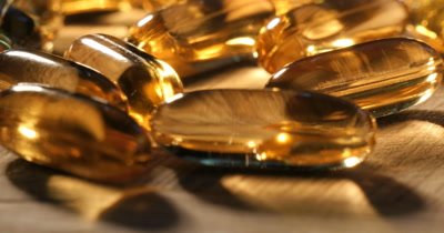 Vitamins and nutritiona supplements health food pill medicine for healthy lifestyle. Slow dolly shot close up of fish oils tablets that contain the omega-3 fatty acids.