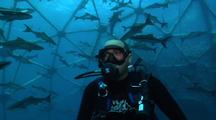 Med Shot Of Diver Inside An Aquapod Fish Farm.