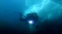Iceberg Underwater With Diver In Front