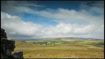 Looking west from Haytor on Dartmoor, UK. Slow pan right to left as shower clouds sweep overhead and ends with rain drops on lens.