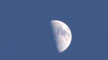 Quarter Moon Slowly Drifting Across Frame