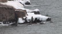 Waves Breaking Against Ice Covered Rock Peninsula, Lake Superior North Shore