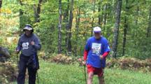 Foot Race, Trekkers Coming Along Same Trail In Woods