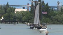 Tall Masted Sailing Ship, Motoring In Harbor, Speedboats Accompany, Vehicles On Bridge