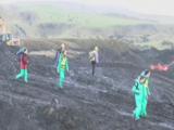 Protestors Make Way Over Edgeof Mine. Open Cast Mine. Wales