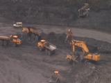 Heavy Machinery Moves At Bottom Of Open Cast Coal Mine. Wales